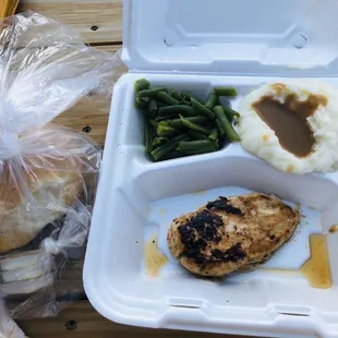 Senior special: grilled chicken, mashed potatoes, brown gravy, green beans and a roll.
