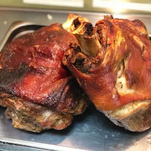 two pieces of meat on a tray