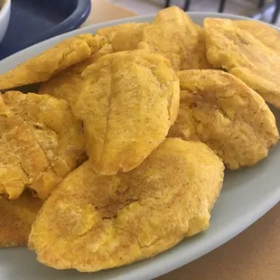 Side of tostones. I repeat: SIDE. At least 10 on sight and the plate is a regular one, not tiny side one.