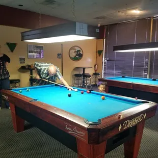 My 2 year old watching my dad shoot pool with me at my college graduation party!