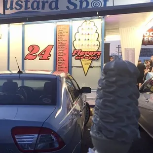 a person holding an ice cream cone