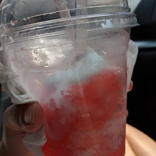 Enjoying a cherry slush float on this hot day! Vanilla soft serve on top of a cherry slushie. The medium is very big!