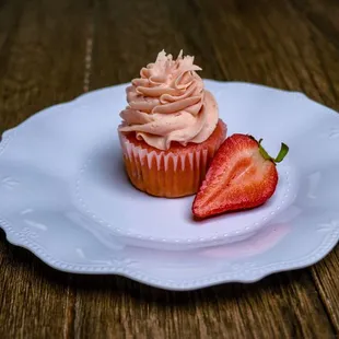 a strawberry on a plate