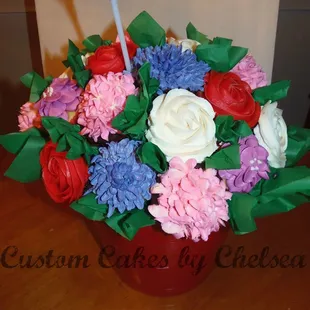 a flower arrangement in a red vase