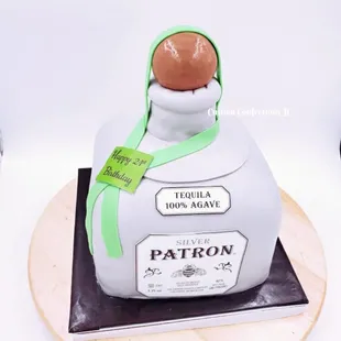 Bottle of Patron Carved Cake. Serves 26