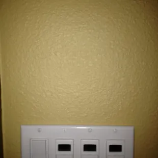 There was approximately a 3"X3" hole above the outlet.