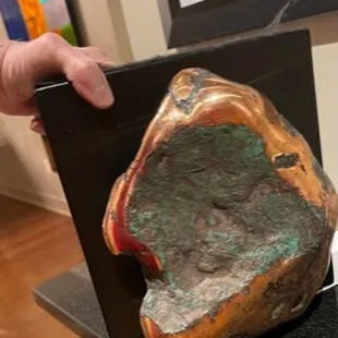 Saw this near pure copper "nugget" at Custom Gem shop.  Had to have it. It's my copper door stopper.