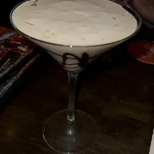 a person holding a martini glass