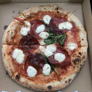 Chef's Special.. pepperoni, basil, fresh mozzarella and topped with their house blend seasoning