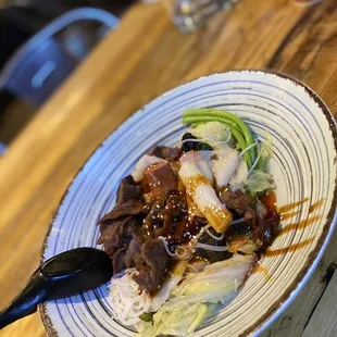 a plate of food on a wooden table