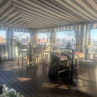 tables and chairs on a deck