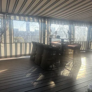 a table and chairs on a deck