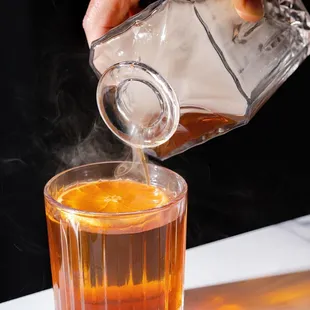 Smoked old fashioned. Our cocktail game is strong. Have a drink with us.