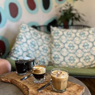 two cups of coffee on a cutting board