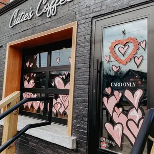 the entrance to cuties coffee