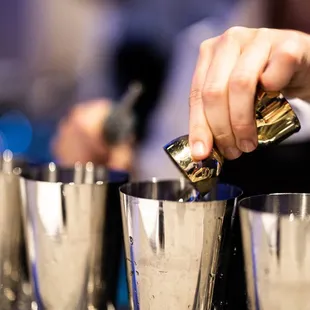 a bartender pouring a drink