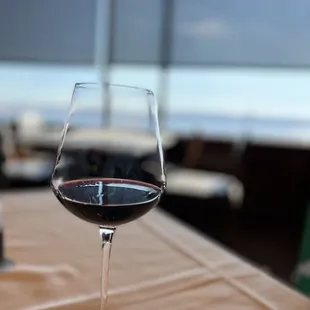 a glass of wine on a table