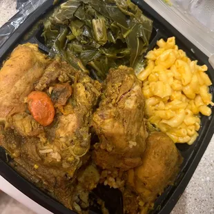 Curry chicken , Rice and peas , collard greens , and Mac n cheese