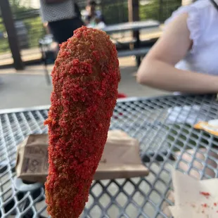 Korean corn dog with flaming hot Cheeto