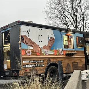 a food truck parked on the side of the road