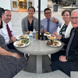 CUSD staff and admin enjoying dinner behind the scenes by the kitchen!