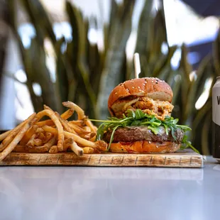 The Devil&apos;s Share Burger paired with a refreshing Whiskey Mule out on our patio.