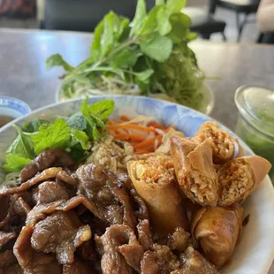 Vermicelli with spring rolls and BBQ pork