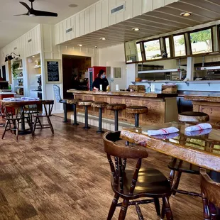 Updated main dining room with original counter, tables and chairs..