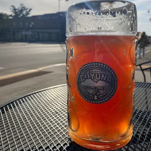 a glass of beer on a table