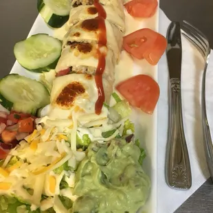 Our new Burrito !  Steak,peppers,mushrooms,served with fresh guacamole,salad and queso.