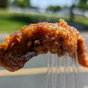 a piece of meat on a fork