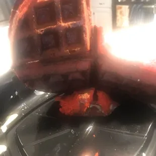 Bottom of burnt waffle. Tried to taste it but the burnt flavor was overpowering.