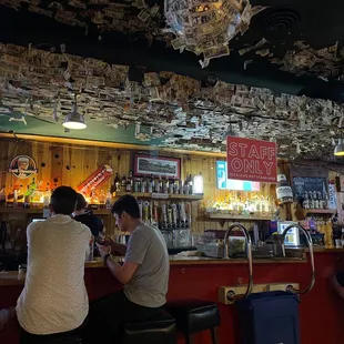 people sitting at the bar