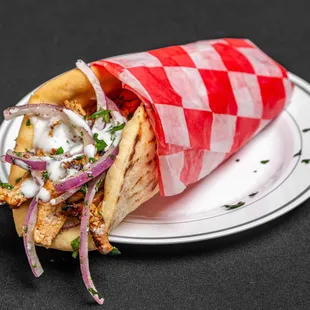 a pita sandwich on a plate