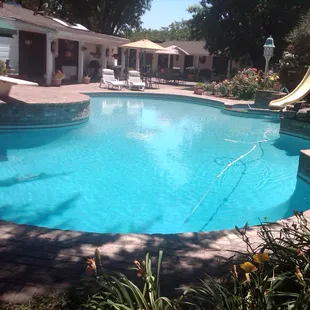 3267 N. Duncan Rd. Linden, CA. Vintage brick patio surrounds the huge deep pool with slide and spa.
