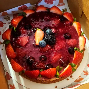 Berries Cheesecake, Graham Crakers crust, Cheesecake batter, topped with Berry Sauce  and fresh berries