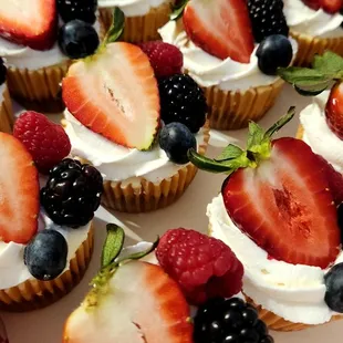 Berries Cheesecake Bites, my cheesecakes batte in mini cupcake size, popped with fresh whipped cream and Berries