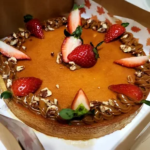 Authentic Mexican Flan Casero made with eggs, sweetened condensed milk and evaporated milk, decorated with Dulce de Leche, pecans and Strawb