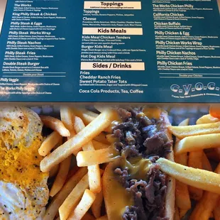 CYOC menu. Left: Philly steak and eggs. Right: Philly cheese steak deluxe with cheddar cheese sauce minus the green peppers.
