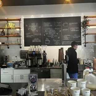 a man standing in a coffee shop