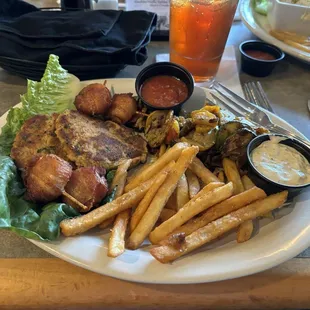 Bacon wrapped scallops and crab cakes