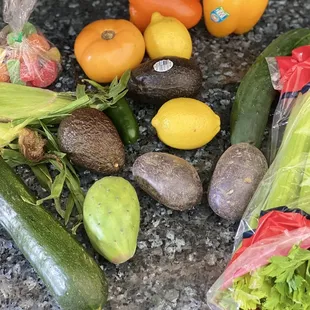 Corn Zucchini  Cucumber  Tomato  Lemon Potato  Bell Peppers  Avocados  ALL OF THIS FOR $13 bucks