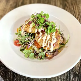 Crab cakes - our featured entree for August, served atop an arugula-quinoa salad.
