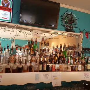 a bar with many bottles of alcohol