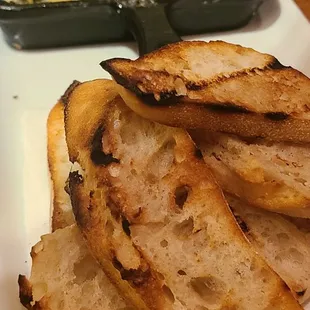 a plate of bread and a casserole dish