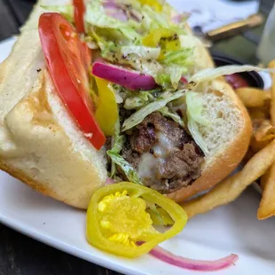 Chicago Steak Sandwich (Philly). $18. Beef top round, American, caramelized onions, Amoroso&apos;s roll.