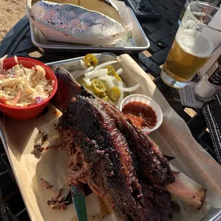 Huge smoked beef rib, coleslaw and baked potato