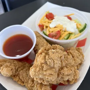 Chicken strips and a side salad
