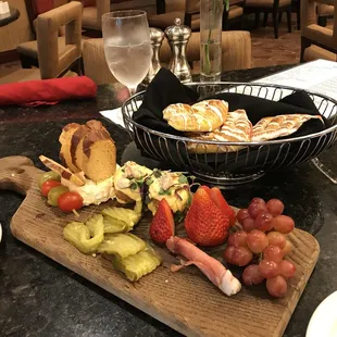 a plate of food and a glass of wine