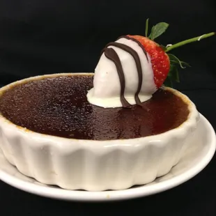 Milk chocolate creme brulee, white chocolate covered strawberry